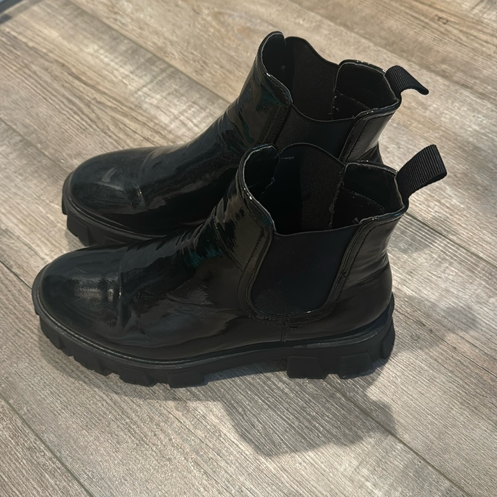 Black shiny boots.